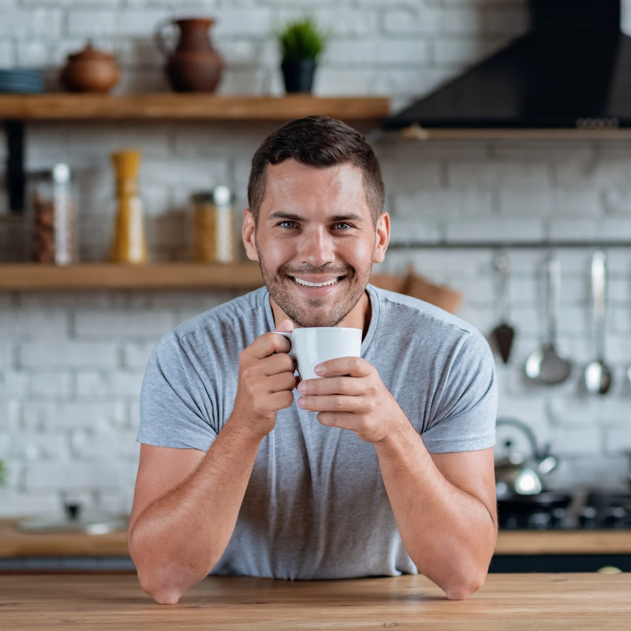 man smiling with coffee | teeth whitening orange county
